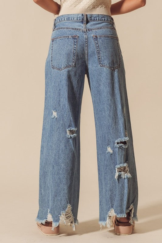 Mid Rise Wide Fit Destructed and Distressed Jeans
